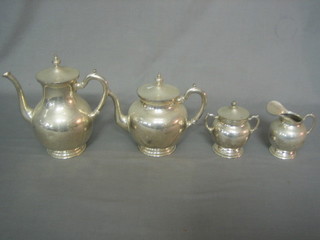 A silver plated 4 piece tea/coffee service comprising teapot, coffee pot, twin handled sugar bowl and cream jug