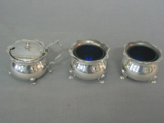 An Edwardian 3 piece silver condiment set comprising circular mustard pot and pair of salts with wavy cut borders, raised on 3 bun feet 6 ozs