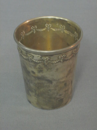 A French silver beaker with embossed decoration, 2 ozs