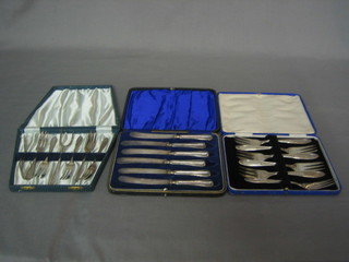 A set of 6 silver handled tea knives and 2 sets of 6 silver plated pastry forks, all cased