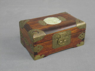 A rectangular Eastern hardwood box containing a small collection of costume jewellery