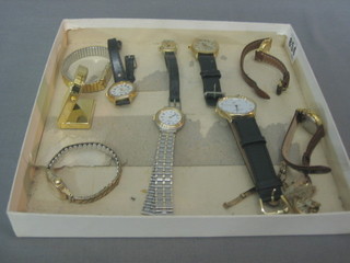 A lady's gold cased wristwatch and a collection of other wristwatches