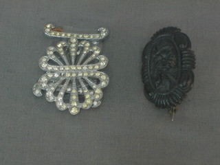 A Victorian "jet" oval shaped brooch together with a diamonte buckle