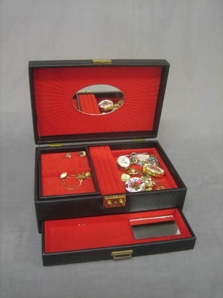 A jewellery box containing a collection of various costume jewellery