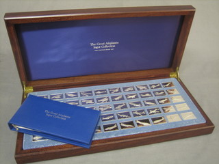 50 silver ingots depicting great aeroplanes, approx 30 ozs together with information book
