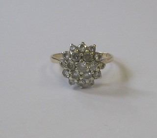 A 9ct gold cluster dress ring set white stones