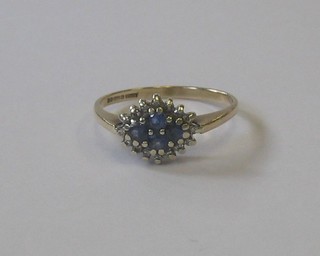 A 9ct gold dress ring set sapphires and diamonds