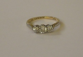 An 18ct yellow gold dress/engagement ring set 3 diamonds