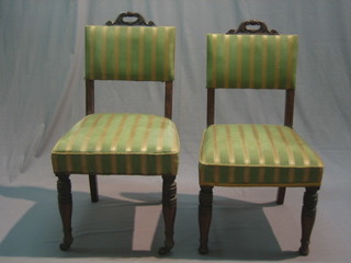 A pair of Victorian Continental mahogany framed dining chairs with upholstered seats and backs, raised on turned supports