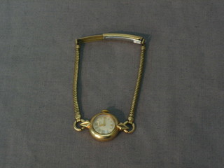 A lady's Longines wristwatch contained in a gold case