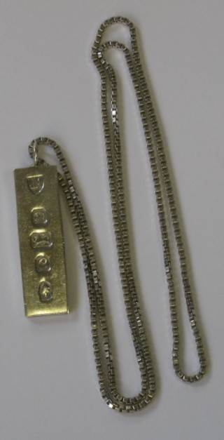 A silver ingot pendant with Silver Jubilee hallmark