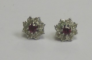 A pair of lady's ruby and diamond earrings