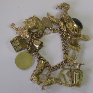 A lady's curb link charm bracelet hung 15 charms, 3 ozs