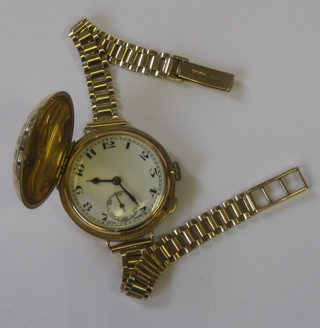 An unusual Golf Ball wristwatch contained in a 9ct gold full hunter case with integral bracelet