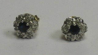 A pair of lady's gold ear studs set sapphires and diamonds