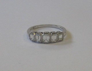 A lady's 18ct white gold dress/engagement ring set 5 rectangular cut diamonds, approx 1.15ct