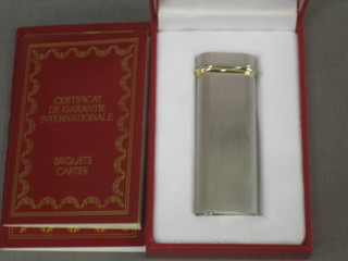 A silver plated Cartier lighter, boxed