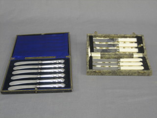 2 sets of 6 silver plated tea knives, cased