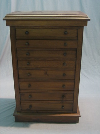 A Victorian style mahogany pedestal chest of 8 long drawers with tore handles, raised on a platform base 23" 