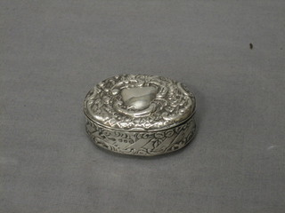 A Victorian oval embossed silver trinket/snuff box, Birmingham 1886, 2"