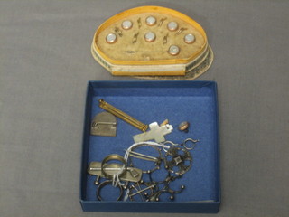 A silver Canterbury cross, a set of dress studs and a small collection of costume jewellery