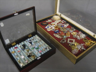 2 display cabinets containing a collection of costume jewellery