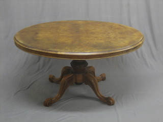 A Victorian oval walnut Loo table, raised on pillar and tripod supports 53"