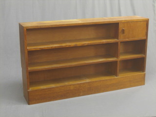 A 1930's oak Heales style bookcase fitted 3 shelves, raised on a platform base 57"