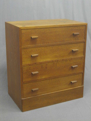 A  Heales style oak chest of four long drawers, raised on a platform base 32"