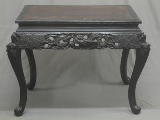A rectangular carved Oriental occasional table, raised on cabriole supports 36"