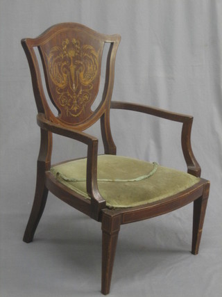 An Edwardian inlaid mahogany shield back open arm chair, raised on square tapering supports