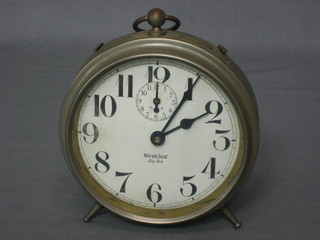An early alarm clock with paper dial and Arabic numerals by Westcox