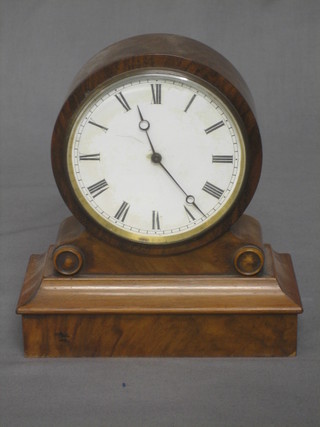 A 19th Century mantel clock with paper dial and Roman numerals contained in a walnut case