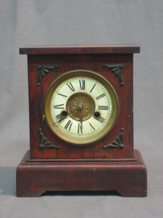 A Continental 8 day mantel clock contained in a walnut case (f)