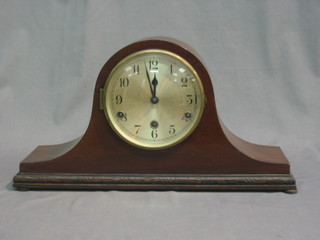 A chiming mantel clock with silvered dial and Arabic numerals contained in an oak Admiral's hat shaped case