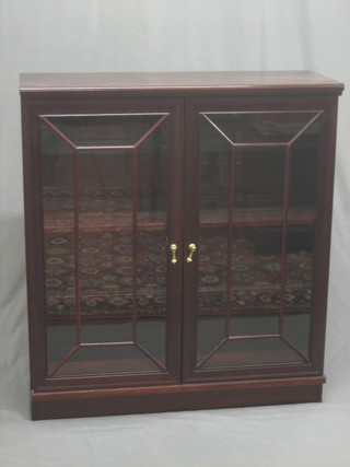 A Georgian style mahogany bookcase, the interior fitted adjustable shelves enclosed by astragal glazed panelled doors 37"