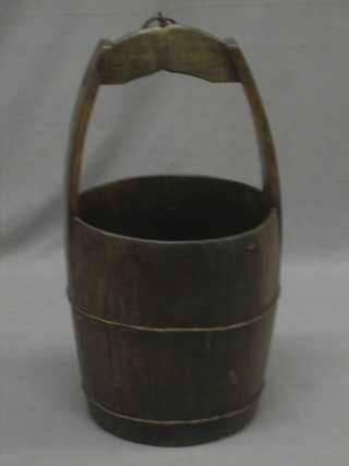 A reproduction Eastern hardwood coopered well bucket