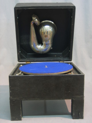 A table top gramophone contained in a fibre case with hinged lid 12"