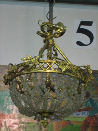 A circular gilt metal electrolier hung circular lozenges