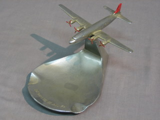 A 1940's/50's Swiss Air chrome ashtray decorated an aircraft in flight