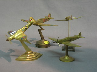 4 brass models of Spitfires