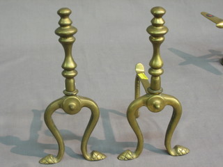 A pair of Adam style brass fire dogs