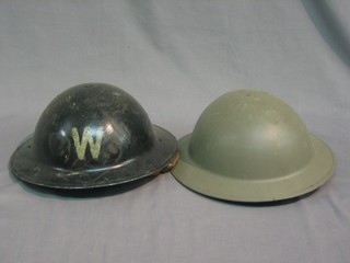A WWII Air Raid Warden's steel helmet and 1 other (2)