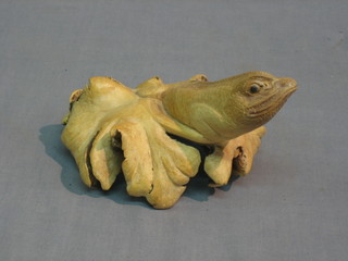 An Eastern carved rootwood figure in the form of a lizard 8"