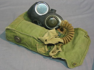 A WWII Service Issue respirator and bag