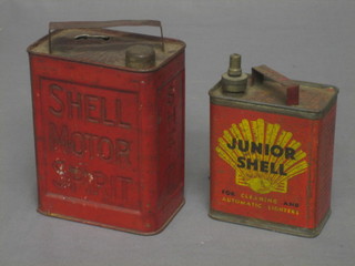 A small red painted Shell Motor spirit petrol can 5" converted for use as a money box and a Junior Shell petrol can 4"