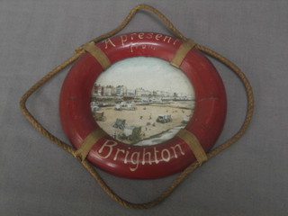 A 19th Century circular painted wooden life ring marked A Present From Brighton 5"