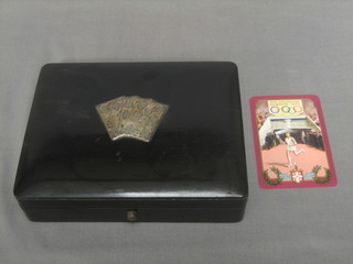 An ebony card box, the lid decorated 4 silver cards containing 2 sets of 1948 Olympic Games playing cards