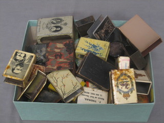 A collection of various enamelled match slip covers