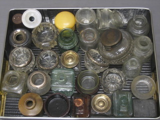 A collection of various old inkwells etc